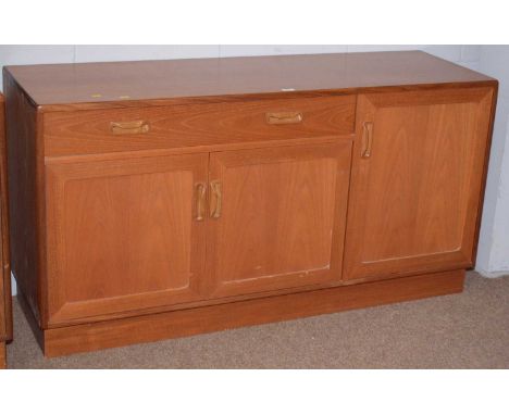 G-Plan: a vintage teak sideboard, with an arrangement of cupboards and single drawer, plinth base, 138 x 44 x 72cms high.