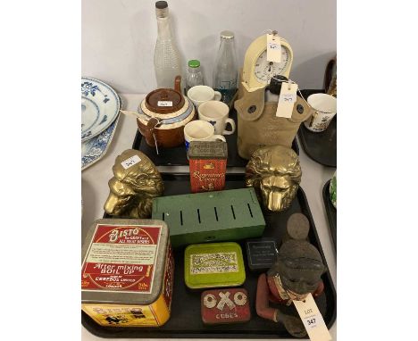 A selection of collectibles, including: pair of brass lions head bookends; jolly man money bank; vintage Smiths Second kitche