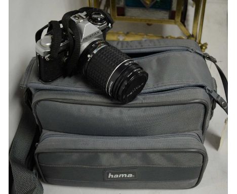 A Pentax ME Super camera, with Asahi Optical Co. Hoya 52mm Skylight (1B) lens, with flash, in Hama camera carry case. 