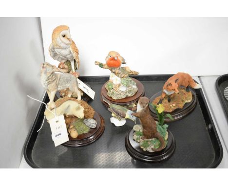 A selection of ceramic and resin animal figures, including: Goebel figure of a Yellow Wagtail; Royal Doulton figure of an ott