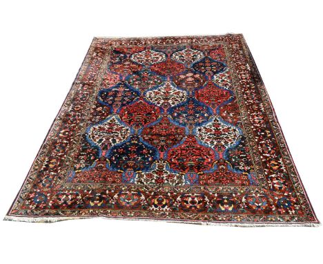 A Bakhtiari carpet, with large floral panels, 429 x 330cms.