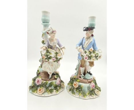 Antique Pair of Sitzendorf Candelabra. A Lady and a Gentleman. Ornate floral decoration throughout. Sitzendorf mark on base. 