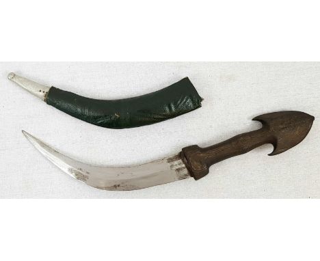 Vintage or possibly antique wood handled Middle Eastern Jambiya style knife in wood and leather sheathe. Length 43cm approx. 
