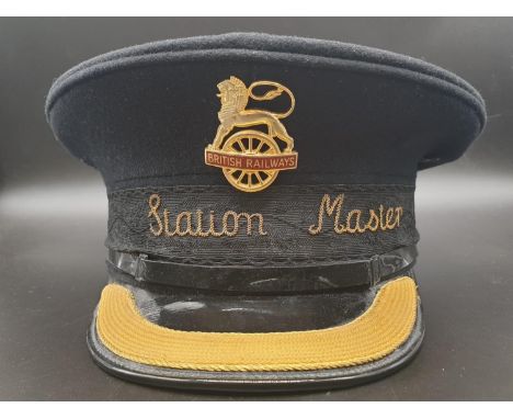 A VINTAGE BRITISH RAILWAYS STATION MASTERS CAP WITH BADGE AND BRAIDING. 