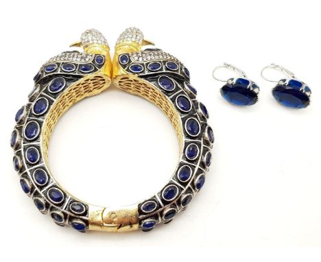 A Bollywood style Indian bangle and complementing earrings in an interesting and unusual presentation box. 