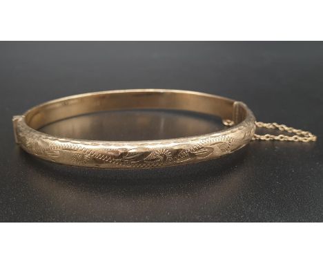 9k Yellow Gold Bangle. 6cm diameter. 8.16g 