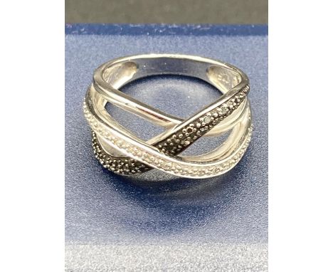 Silver crossover ring having light and dark Silver Marcasite  to top .925 silver .size M 