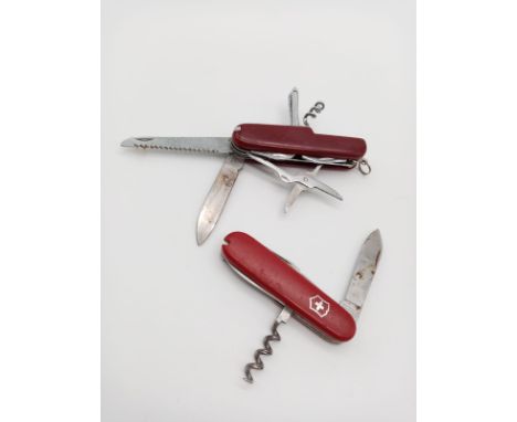 A pair of Army Swiss Style Utility Knives. 