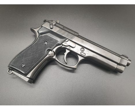 Replica Beretta Handgun. With slide out magazine, heavy metal feel. Dry firing action, takes inert shells in magazine.  22cm.