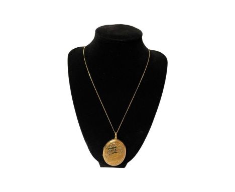 Vintage huge 9ct gold locket back and front on yellow metal chain, 13g gross weight. 
