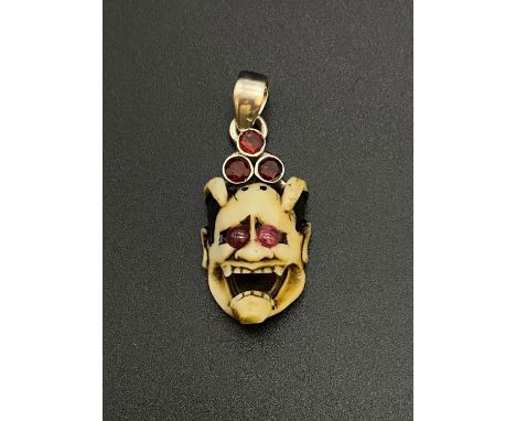 Meiji Period Carved Devil with Ruby and Garnet Silver Pendant. 