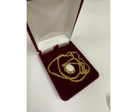 Vintage 9ct gold and Opal pendant on yellow metal chain , gross weight 5.3g. 