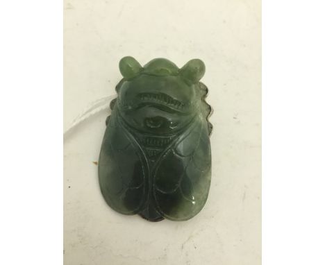 A jade carved moth with silver mount
