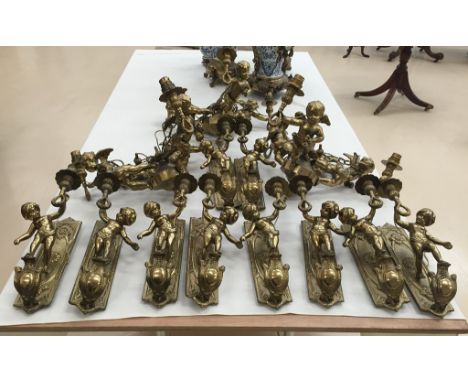 A set of 10 brass wall light fittings of cherubs; together with three matching chandeliers