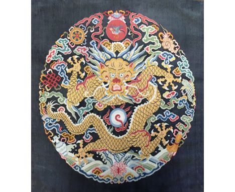 A Chinese kesi twelve-symbol 'moon' badgeEarly 19th centuryFinely woven in gold and coloured threads on black silk ground. Re