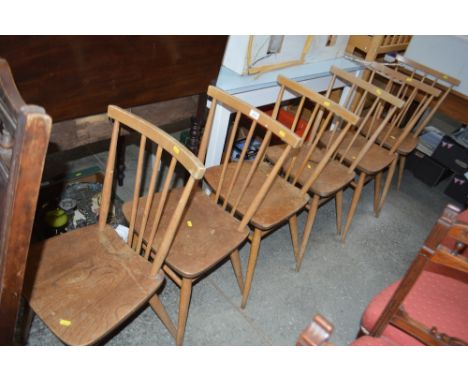 A set of six stick back dining chairs 