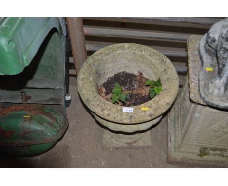 A concrete garden planter on stand