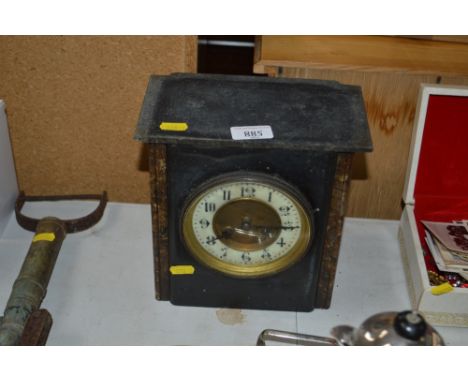 A slate cased two hole mantel clock