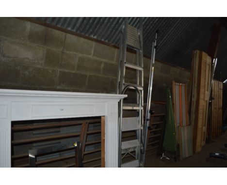 An aluminium step ladder; and a set of steps 