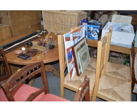 A pine circular topped table raised on tripod base; together with a set of four beach slat back dining chairs 