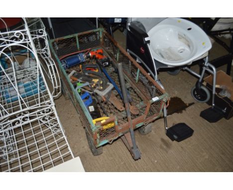 A garden trolley AF and contents of various saws and tools etc