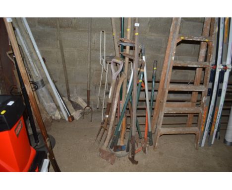 A quantity of long handled gardening tools etc. 
