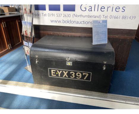 A large Brooks domed black leather trunk, with metal fittings, bears label Brooks, 60cm x 100cm x 60cm