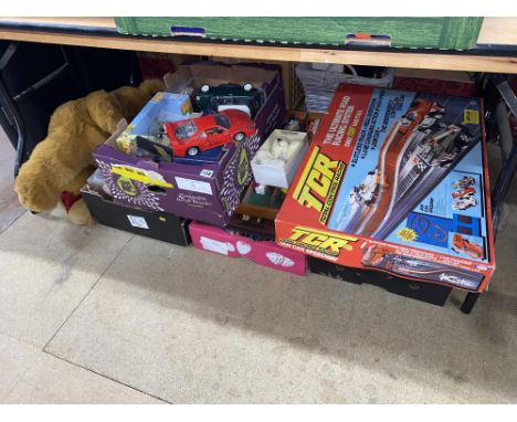 An assorted collection of toys including an Ideal TCR Jam Car Speedway set, Merrythought teddy bears, diecast and humorous ga