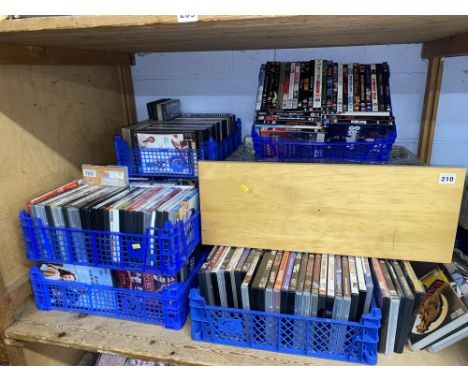 Six boxes of DVDs of mixed genres, including Elvis Presley, Gosford Park, Equilibrium, Fawlty Towers, and The Bucket List