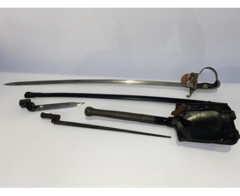 An early 20th Century Ernst Pack and Sohne Solingen German bayonet with sheath, 97cm L, two spike bayonets and a German milit