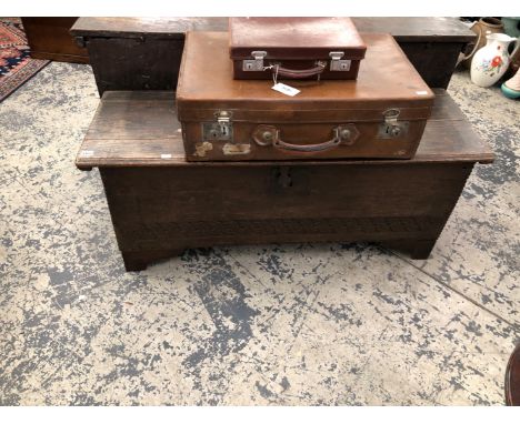 AN 18th  C. OAK COFFER WITH A CHIP CARVED RECTANGULAR LID, A GUILLOCHE BAND CARVED TO THE FRONT ABOVE THE BRACKET FEET.   W 1