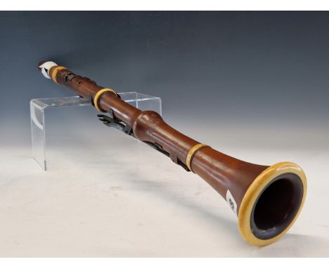 A JAMES WOOD &amp; SONS BOX WOOD AND IVORY CLARINET WITH FOURTEEN STOPS.   67cms 