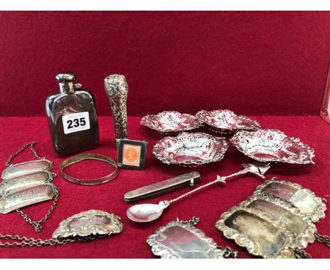 EIGHT SILVER BOTTLE LABELS, FOUR SILVER BONBON DISHES, A SILVER HIP FLASK, 254Gms., A SILVER MOUNTED PEN KNIFE, A PARASOL HAN