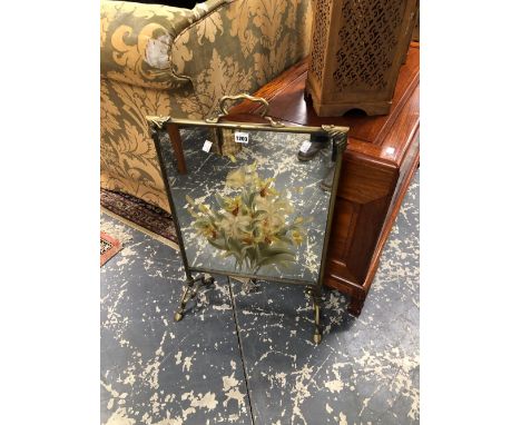 A BRASS FRAMED MIRROR FIRE SCREEN PAINTED WITH A BUNCH OF WHITE LILIES