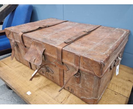 A LARGE ANTIQUE LEATHER TRUNK WITH TWO STRAPS AND HANDLES.   W 96 x D 60 x H 36cms.