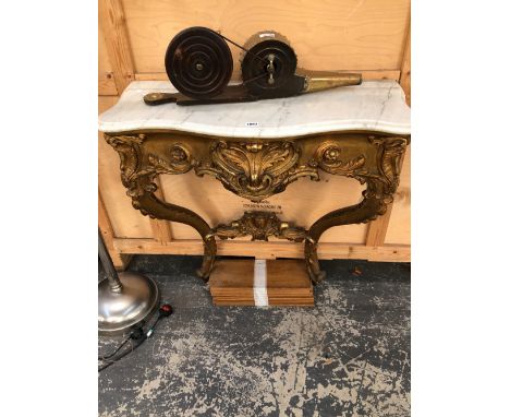 A VICTORIAN ROUND ARCHED RECTANGULAR MIRROR WITHIN A GILT CABOCHON BANDED FRAME CRESTED BY ROCAILLE SCROLLS AND FOLIAGE. 156 