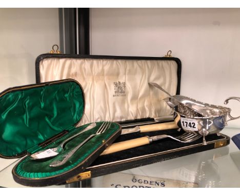 A HALLMARKED SILVER SAUCE BOAT AND EMBOSSED SIFTER SPOON. A CASED FORK AND SPOON A CASED SILVER PLATED FISH SERVER AND A SWEE