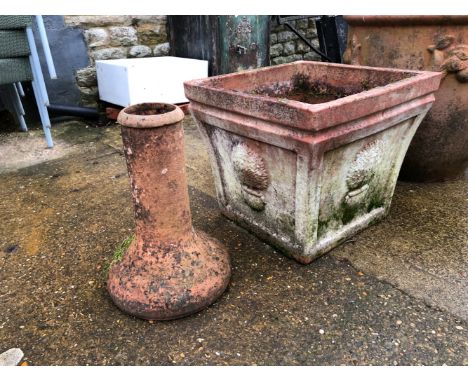 A LARGE SQUARE TERRECOTTA PLANTER AND A TERRECOTTA FORCER.