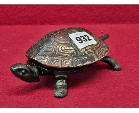 A VINTAGE TABLE BELL IN THE FORM OF A TORTOISE, THE CLOCKWORK WOUND BELL SOUNDING WHEN THE HEAD OR TAIL IS DEPRESSED. 18 cm L