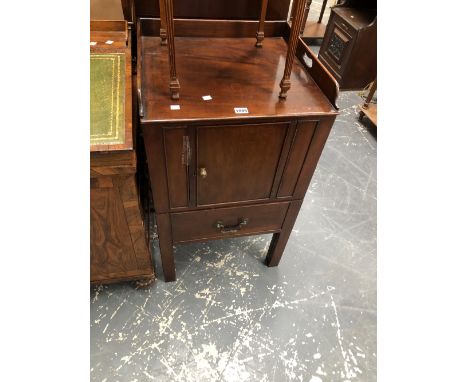 A GEORGE III MAHOGANY NIGHT TABLE WITH A THREEQUARTER GALLERIED TOP ABOVE A DOOR AND A DRAW OUT COMMODE DRAWER