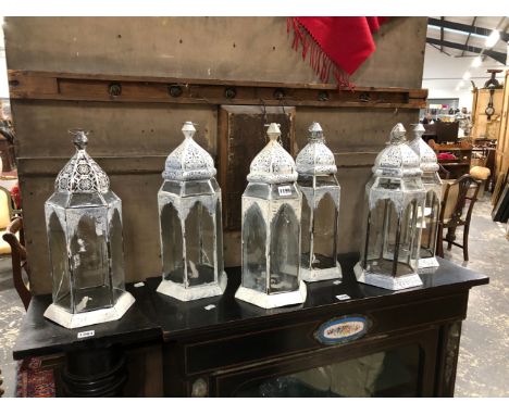 SIX GLAZED WHITE PAINTED METAL PRICKET CANDLESTICK LANTERNS