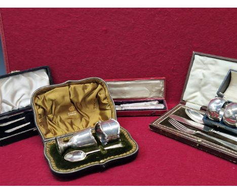 A CASED SILVER KNIFE AND FORK, A CASED SILVER FORK AND SPOON, A CASED THREE PIECE ELECTROPLATE KNIFE, FORK AND SPOON, A CASED