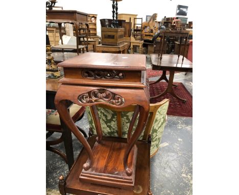 A PAIR OF CHINESE HARDWOOD SIDE TABLES WITH SCROLL PIERCED APRONS AND CABRIOLE LEGS RESTING ON PLINTH FEET