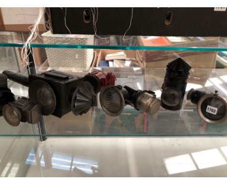 A COLLECTION OF SEVEN  VINTAGE CYCLE AND CARRIAGE LAMPS.