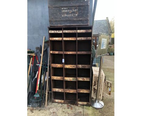A VINTAGE STEEL PARTS RACK OF PIGEON HOLE TYPE TOGETHER WITH A TIN TRUNK.