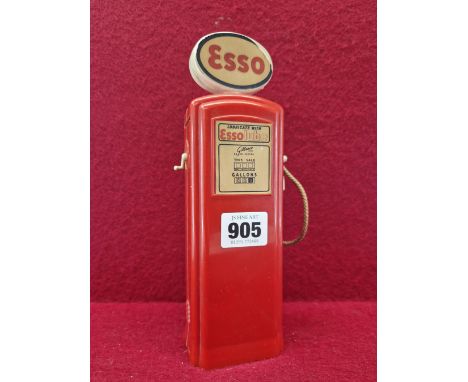 A RED PLASTIC ESSO PETROL PUMP MONEY BOX WITH GILBARCO PAPER LABELLING.   H 22.5cms.