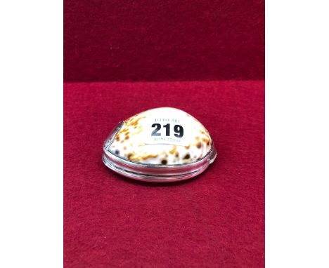 AN IRISH SILVER MOUNTED COWRIE SHELL SNUFF BOX, PREVIOUSLY ATTRIBUTED TO CORK, CIRCA 1760, THE LID EMBOSSED WITH A LADY SEATE