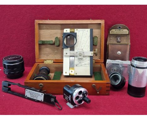 A GROUP OF VINTAGE OPTICAL INSTRUMENTS AND LENSES TO INCLUDE A STUARTS MARINE DISTANCE METER BY HENRY HUGHES &amp; SONS.(SERI