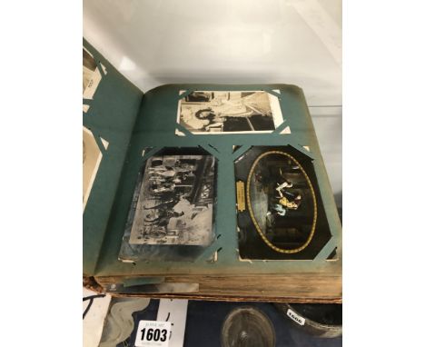 A LARGE VINTAGE POSTCARD ALBUM.
