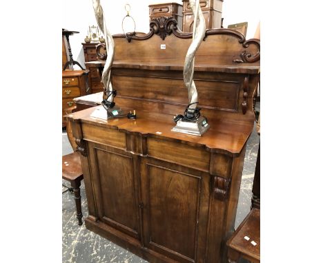 A VICTORIAN MAHOGANY CREDENZA, THE SHELF BACK RECESSED ABOVE A LONG DRAWER, PANELLED DOORS AND THE PLINTH FOOT.   W 107 x D 3